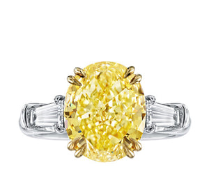 Oval Cut Fancy Yellow Diamond with Baguettes Ring