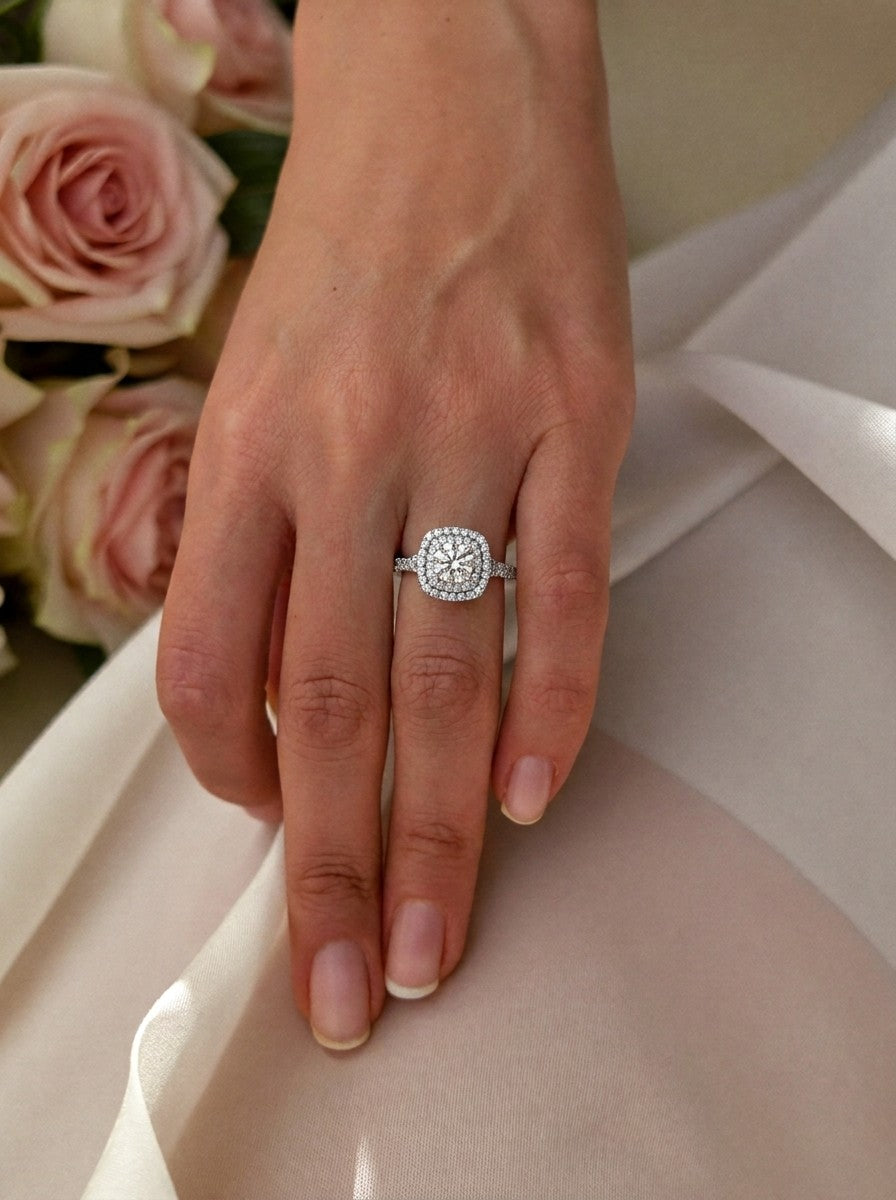 'Emma' Round Brilliant Cut Engagement Ring on the hand, white gold