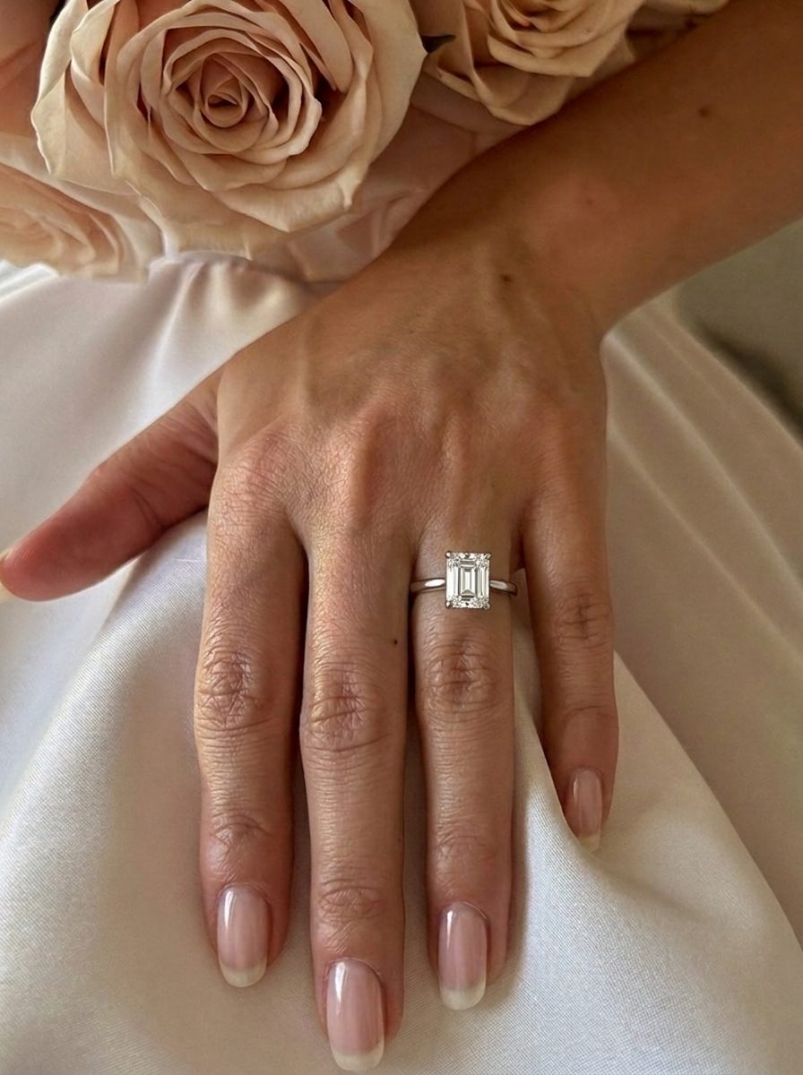 'Katie' Emerald Cut Lab Grown Engagement Ring on the hand, white gold