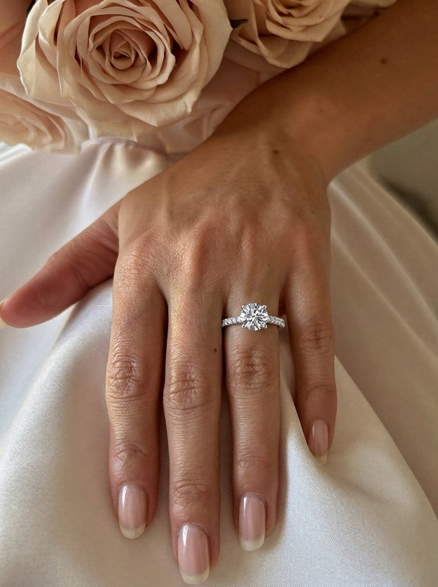 'Sasha' Round Brilliant Cut Engagement Ring on the hand, white gold